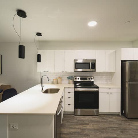 View of spacious open kitchen at The Cooper apartments